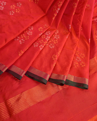 Dual tone orange and red pure silk Uppada Jamdani handloom saree with floral motifs and gold zari kaddi border