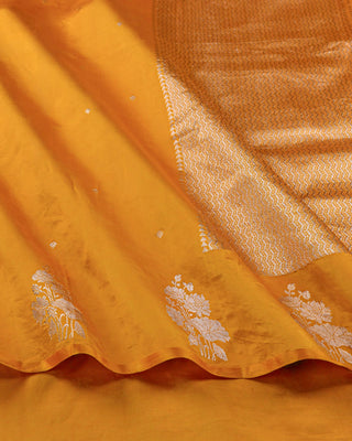Mustard yellow Poona silk saree with silver zari floral motifs and striped blouse