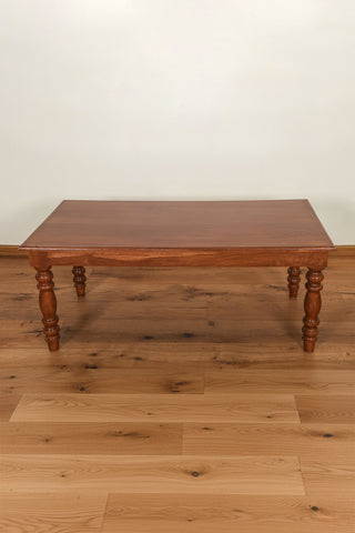 Vintage solid teakwood center table with turned legs and natural wood grain