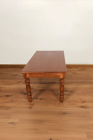 Vintage solid teakwood center table with turned legs and natural wood grain
