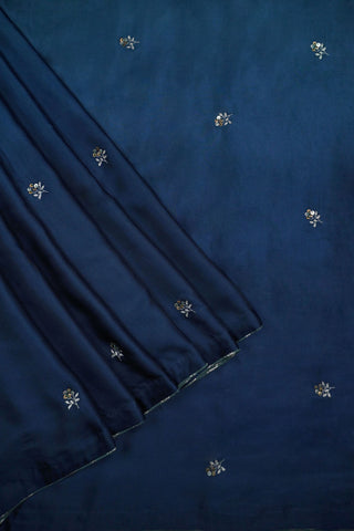 Teal to navy ombre modal silk saree with machine embroidered floral motifs and zari blouse