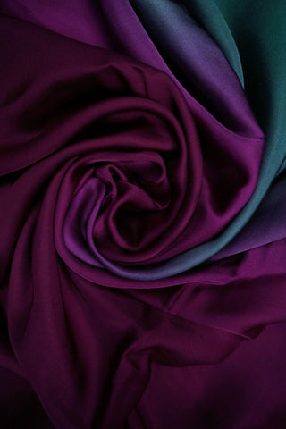 Emerald green to magenta purple ombre modal silk saree with zari striped facing and navy blouse