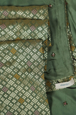 Lime to olive green ombre modal silk saree with bronze hand embroidered floral buttis and jacquard blouse