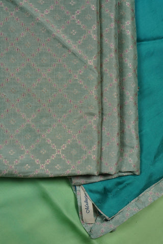 Light green to teal ombre modal silk saree with hand embroidered floral buttis and woven blouse
